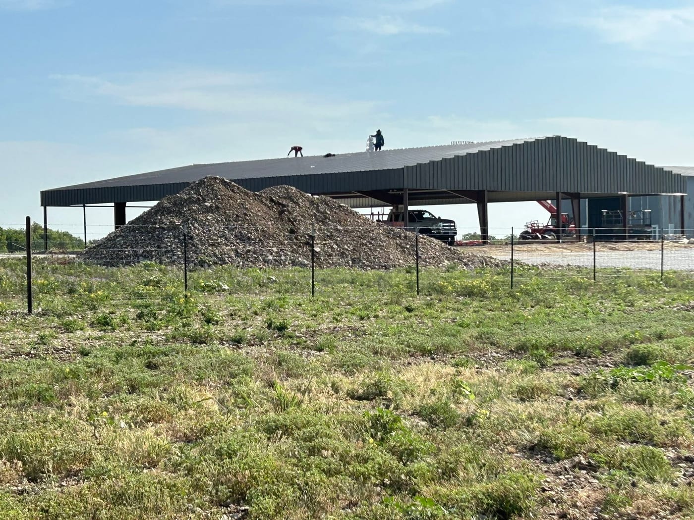 Covered riding arena with open sides